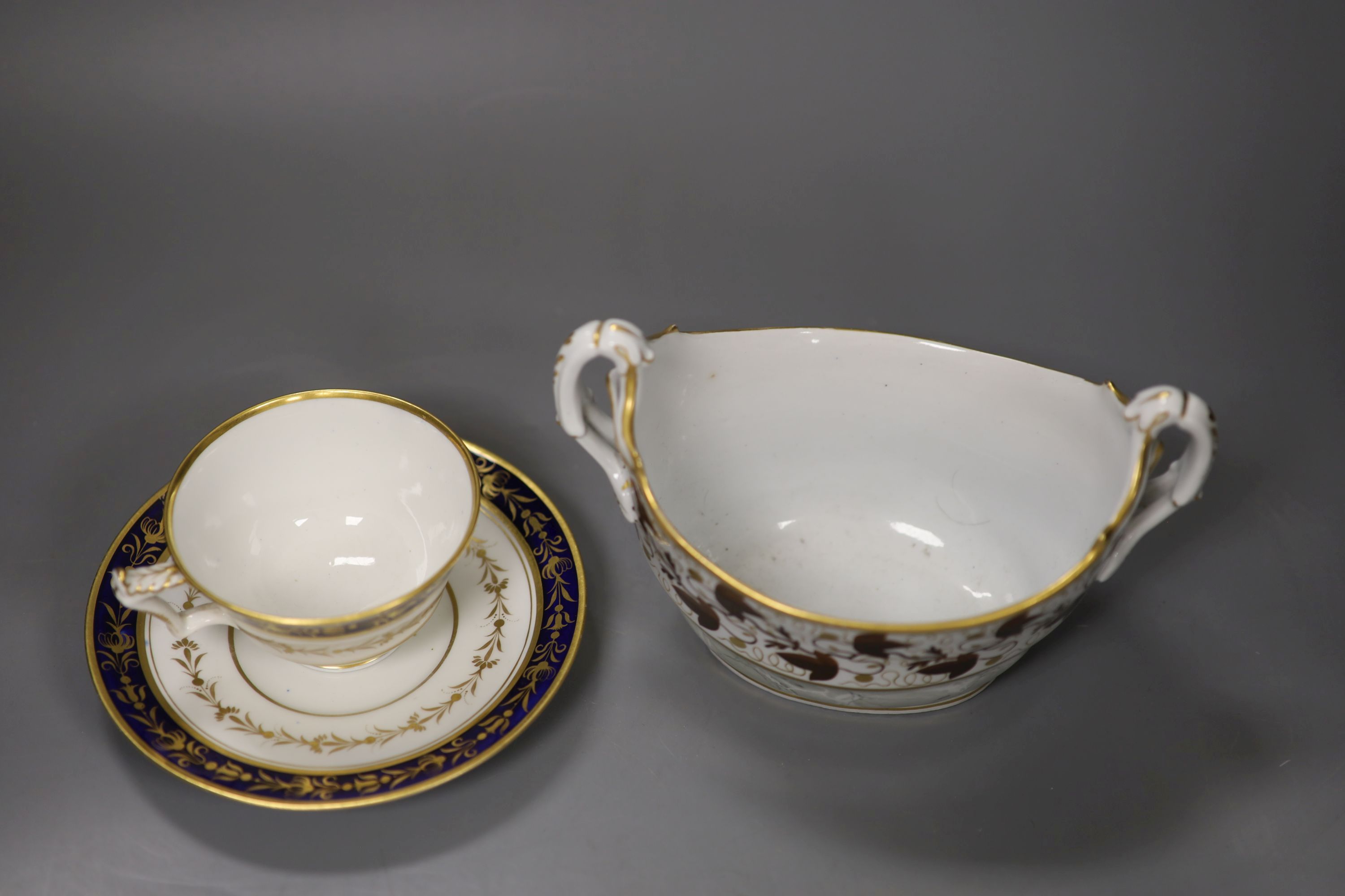 A Flight Barr boat shaped sucrier with brown leaves and gilding above a marbled ground,